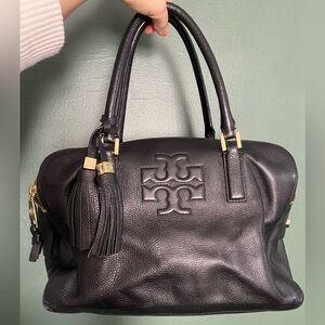 Tory Burch- embossed logo Black Leather Handbag with gold hardware and tassels